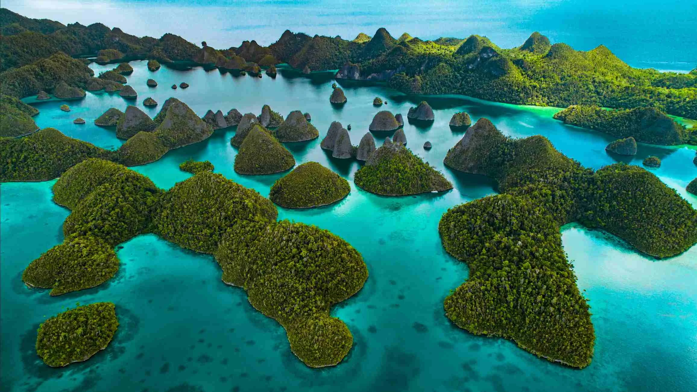 A studio designed yacht sailing in Raja Ampat